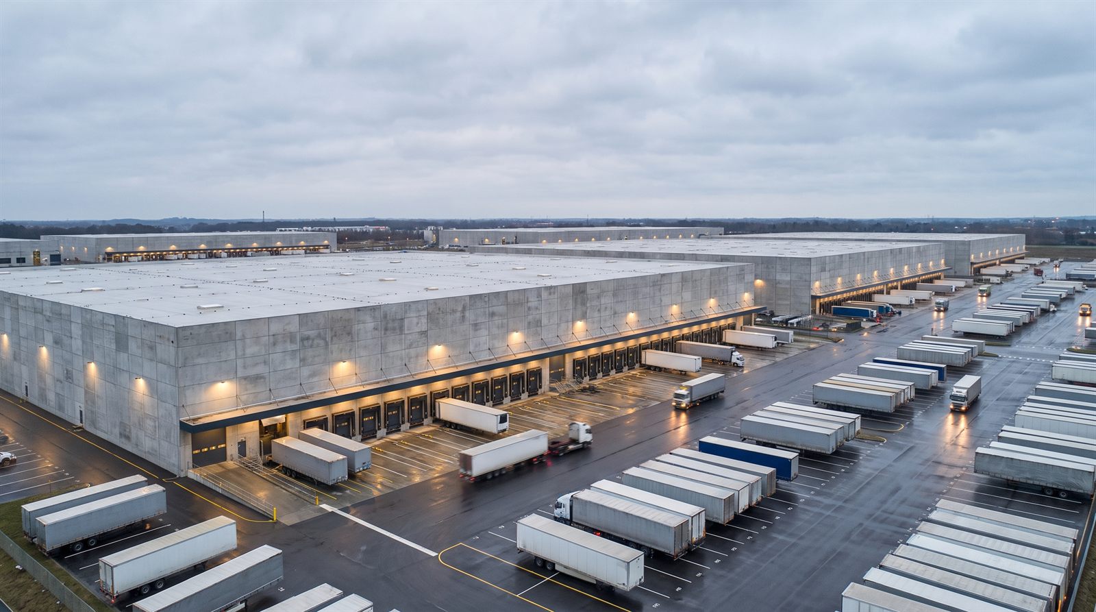 Placeholder photography: Meridian Logistics Park silos and conveyor.